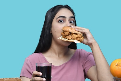 a woman eating a sandwich