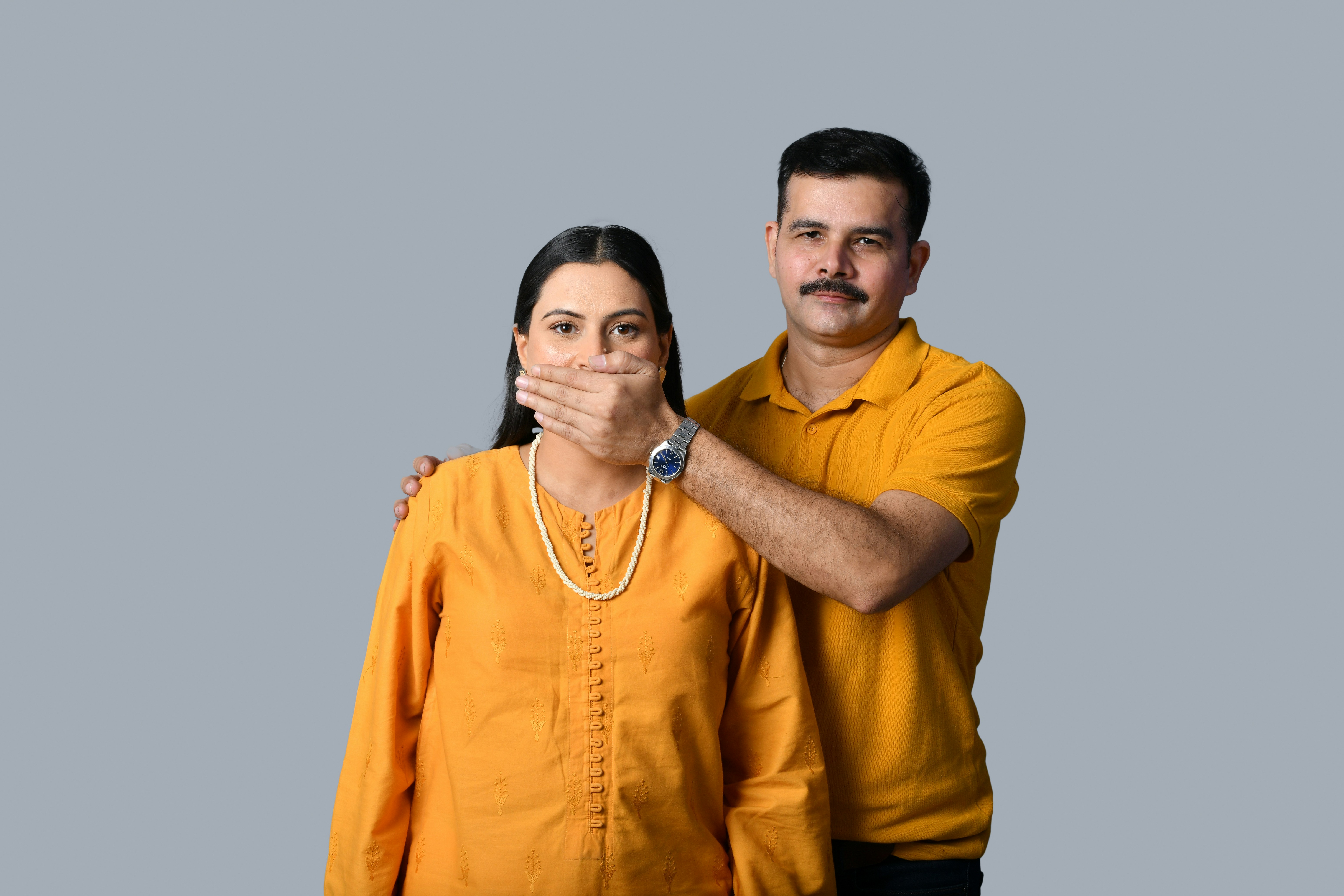 a man and woman posing for a picture