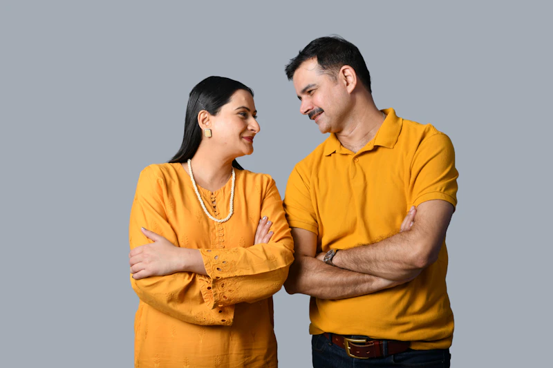 man and woman smiling while standing together