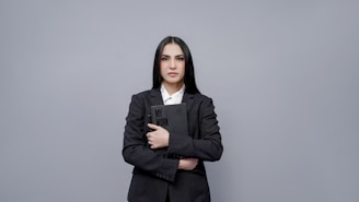 a person holding a laptop