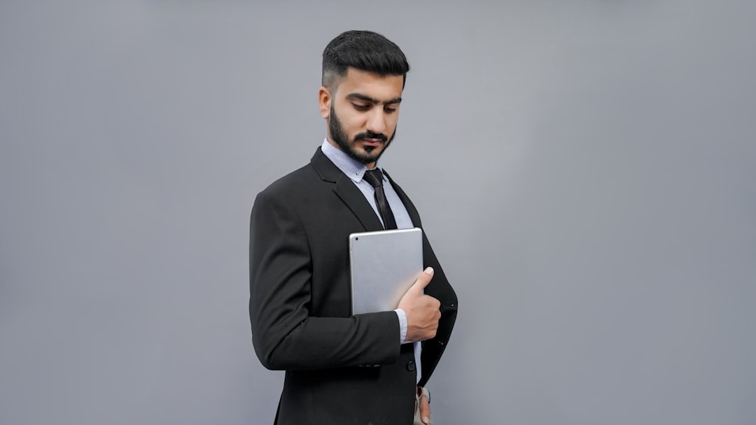 a man holding a tablet, Download Mega Bundle 5,000+ awesome stock photos with commercial license With 16 categories | Perfect for websites, ads and marketing campaigns in South Asian countries. Get access at 50% discount on www.fotos.pk