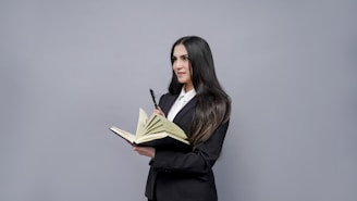 a woman holding a book