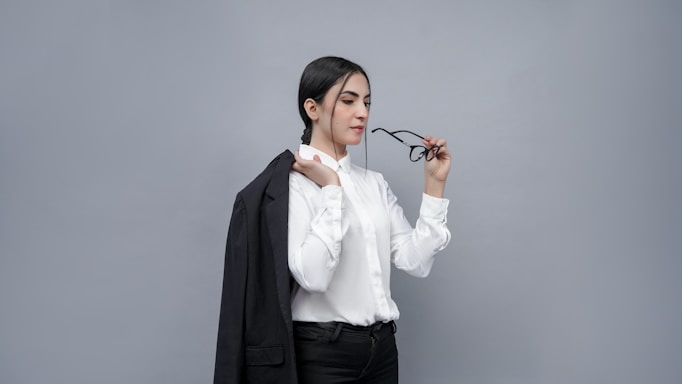 A friendly customer service representative wearing stylish eyeglasses, ready to assist.