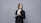 a person in a suit holding a clipboard