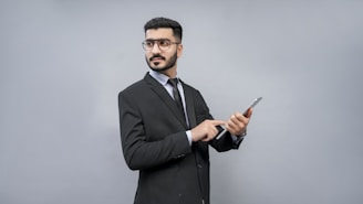 a man holding a pen