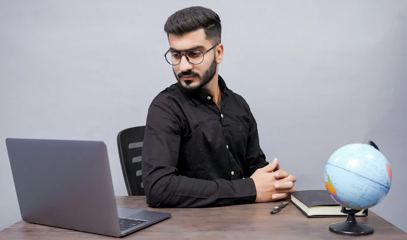 Indian corporate employee working at an office desk