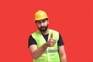 a person wearing a yellow hard hat