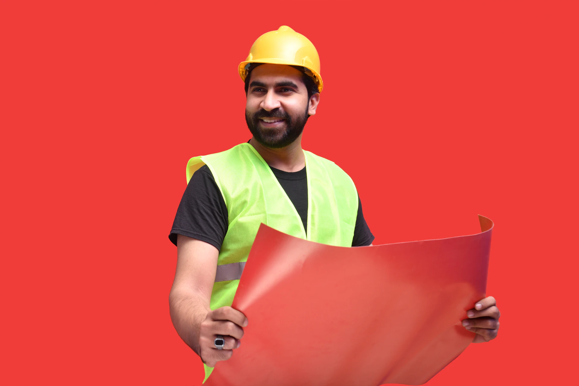 a person wearing a hard hat holding a red folder