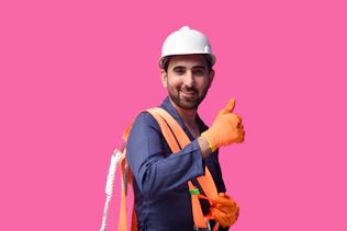 a person wearing a hard hat and safety vest