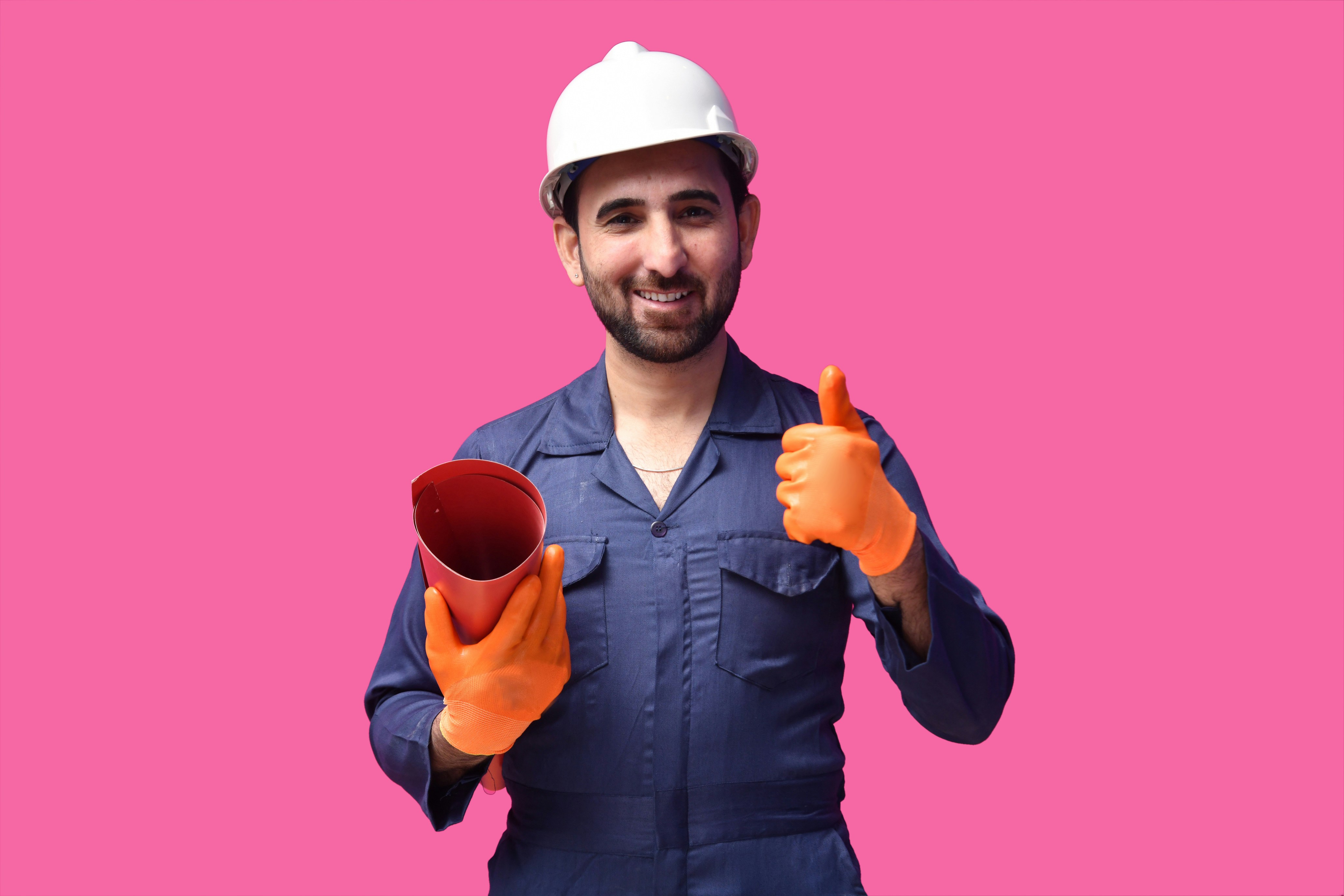 a person wearing a hard hat and holding a ball