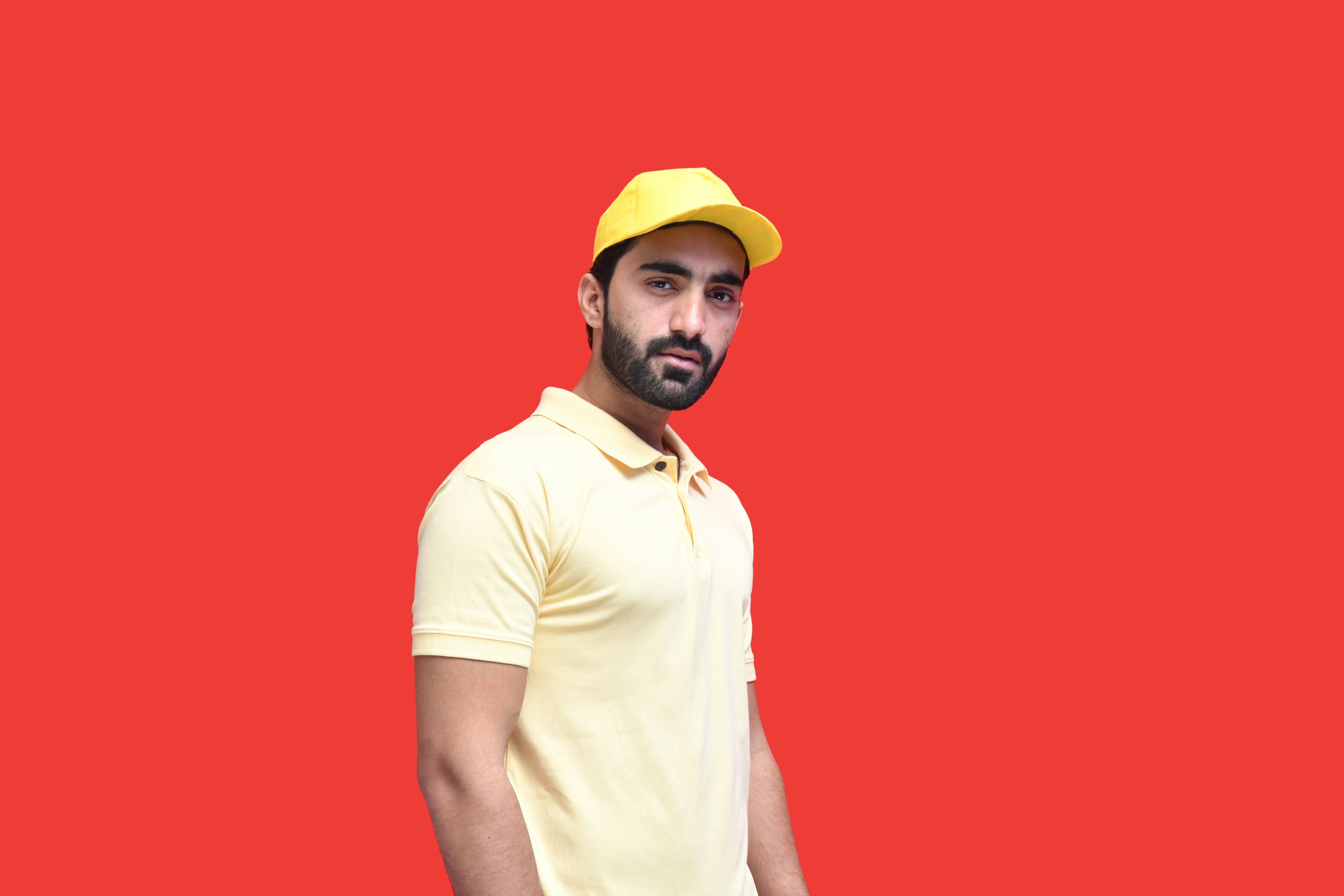 a man wearing a yellow hat