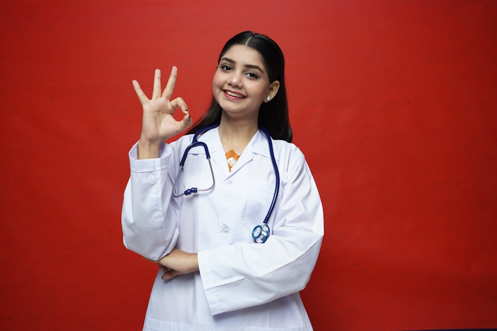 a doctor with her hand up