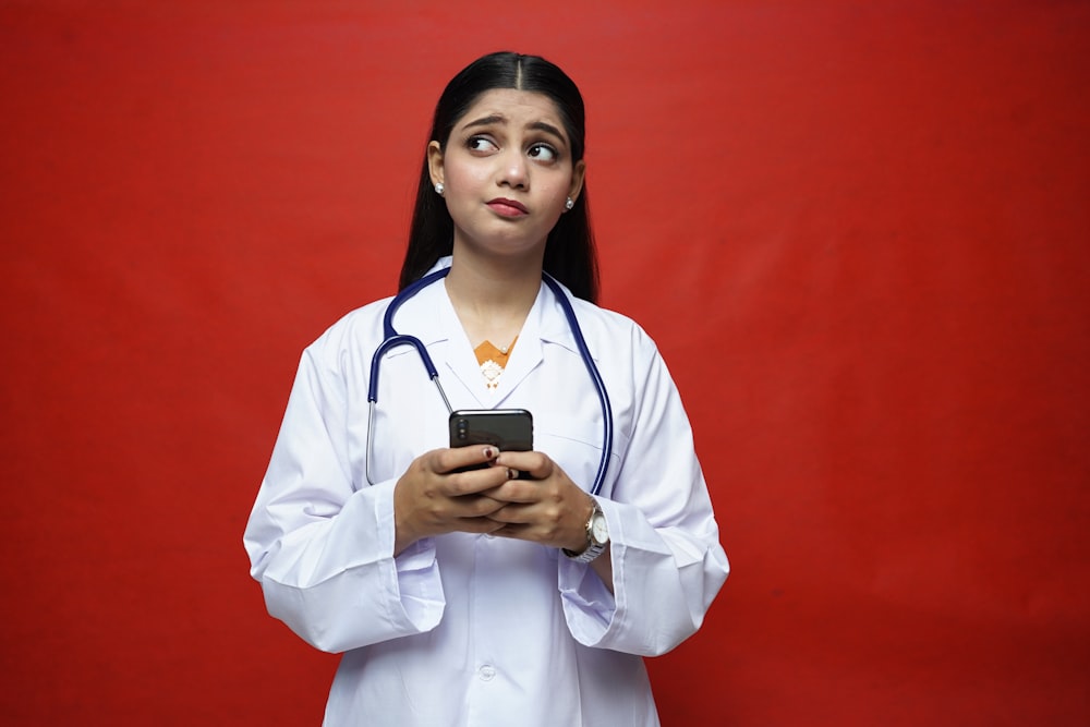 a doctor holding a phone