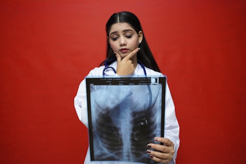 a woman with her hand on her chin