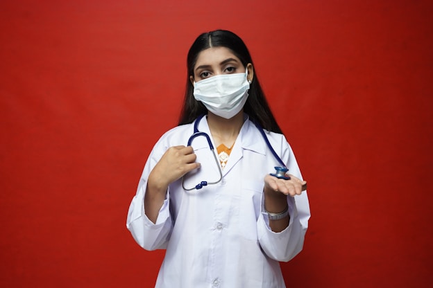 a doctor with a stethoscope around her neck