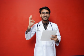 a man in a white coat holding a piece of paper