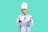 a young boy wearing a chef's hat holding a plate