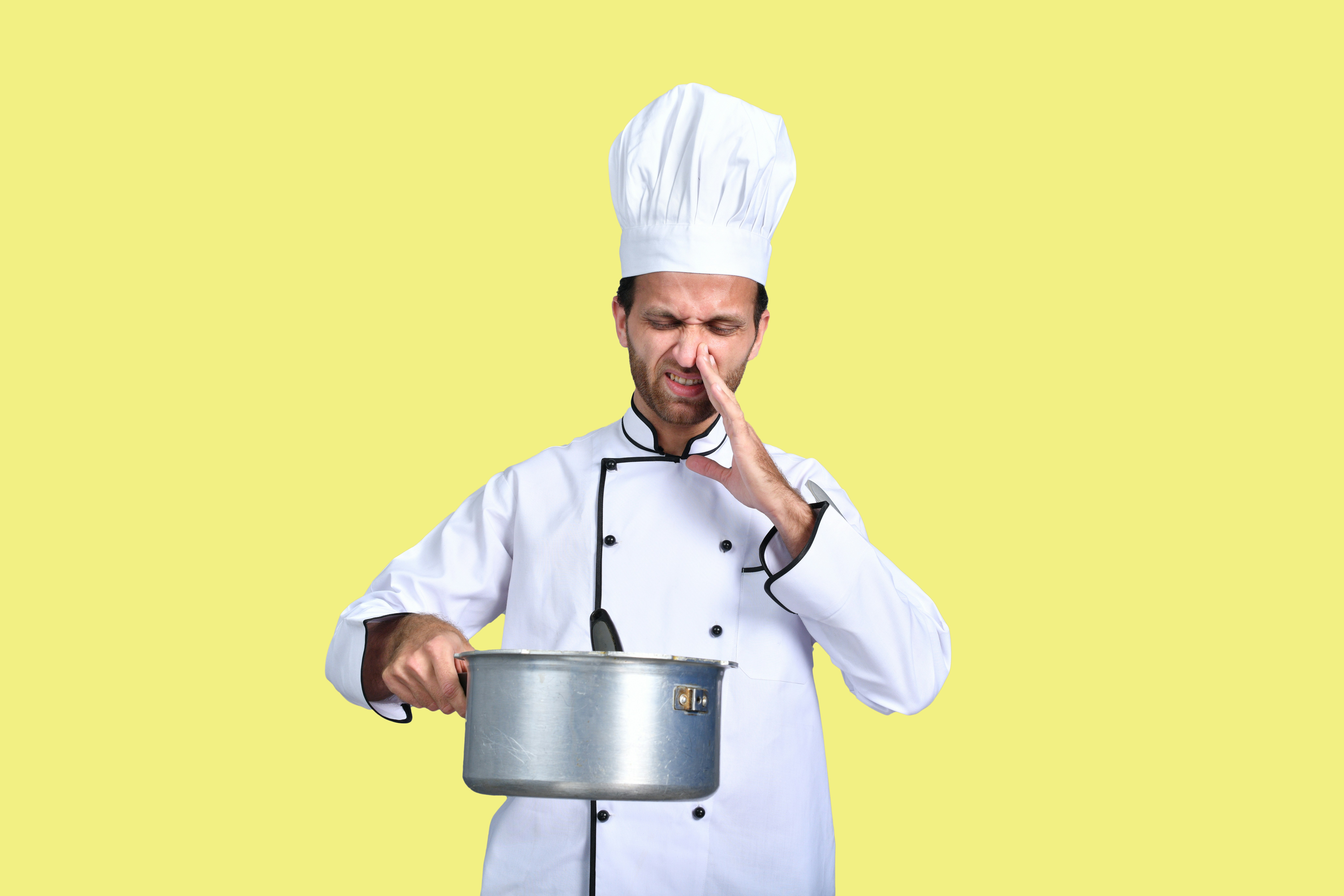 a chef holding a pot