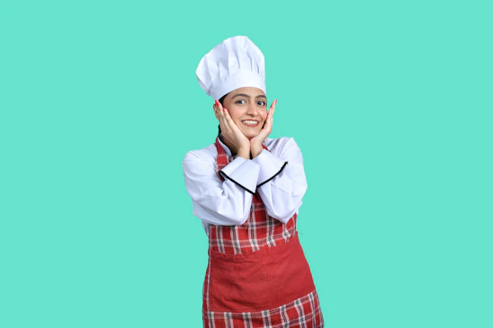 a person wearing a white hat and holding the hands up