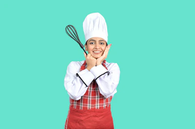 A happy customer holding a personalized apron in a bright kitchen
