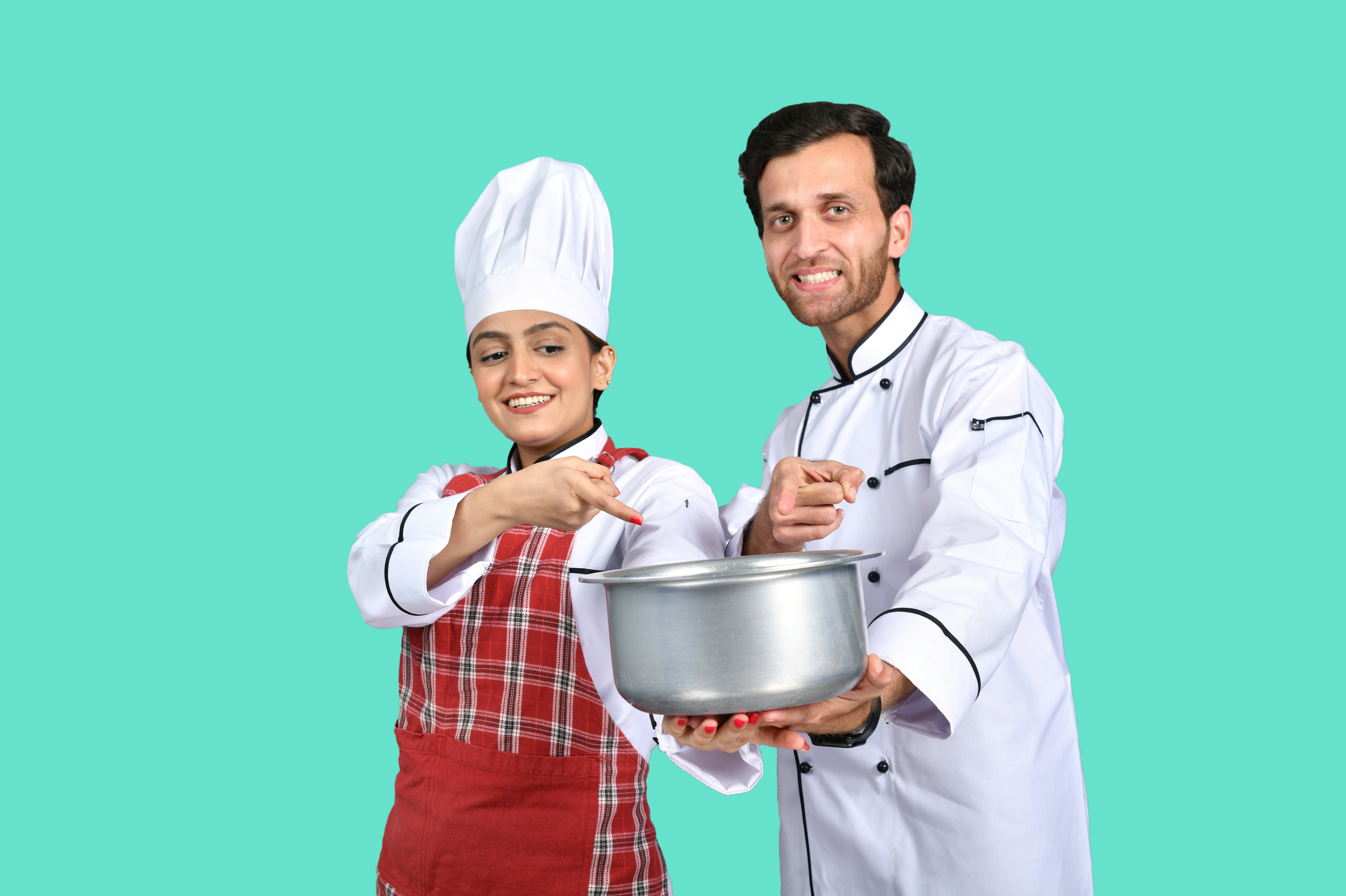 a person and a boy holding a silver bowl