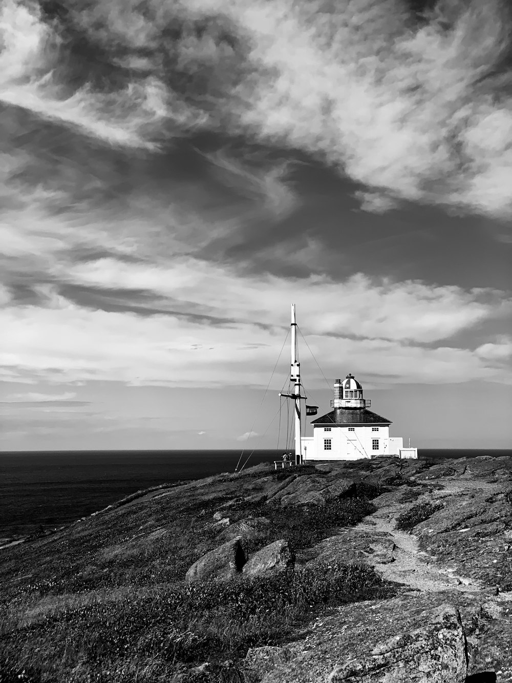 a lighthouse on a rocky beach