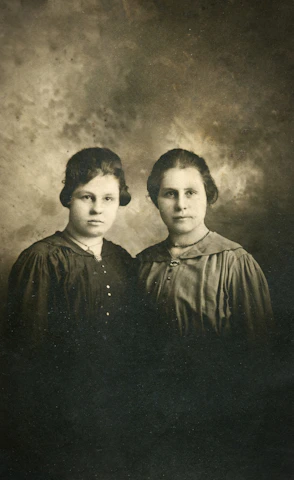 A sepia-toned photograph of Nancy Jane Lencor Haskins in a vintage dress.