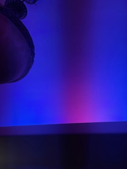 A serene blend of deep purple and blue hues with a subtle silhouette of Lord Shiva meditating under a starry night, symbolizing the fusion of technology and spirituality.