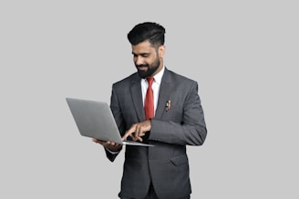 a man holding a laptop