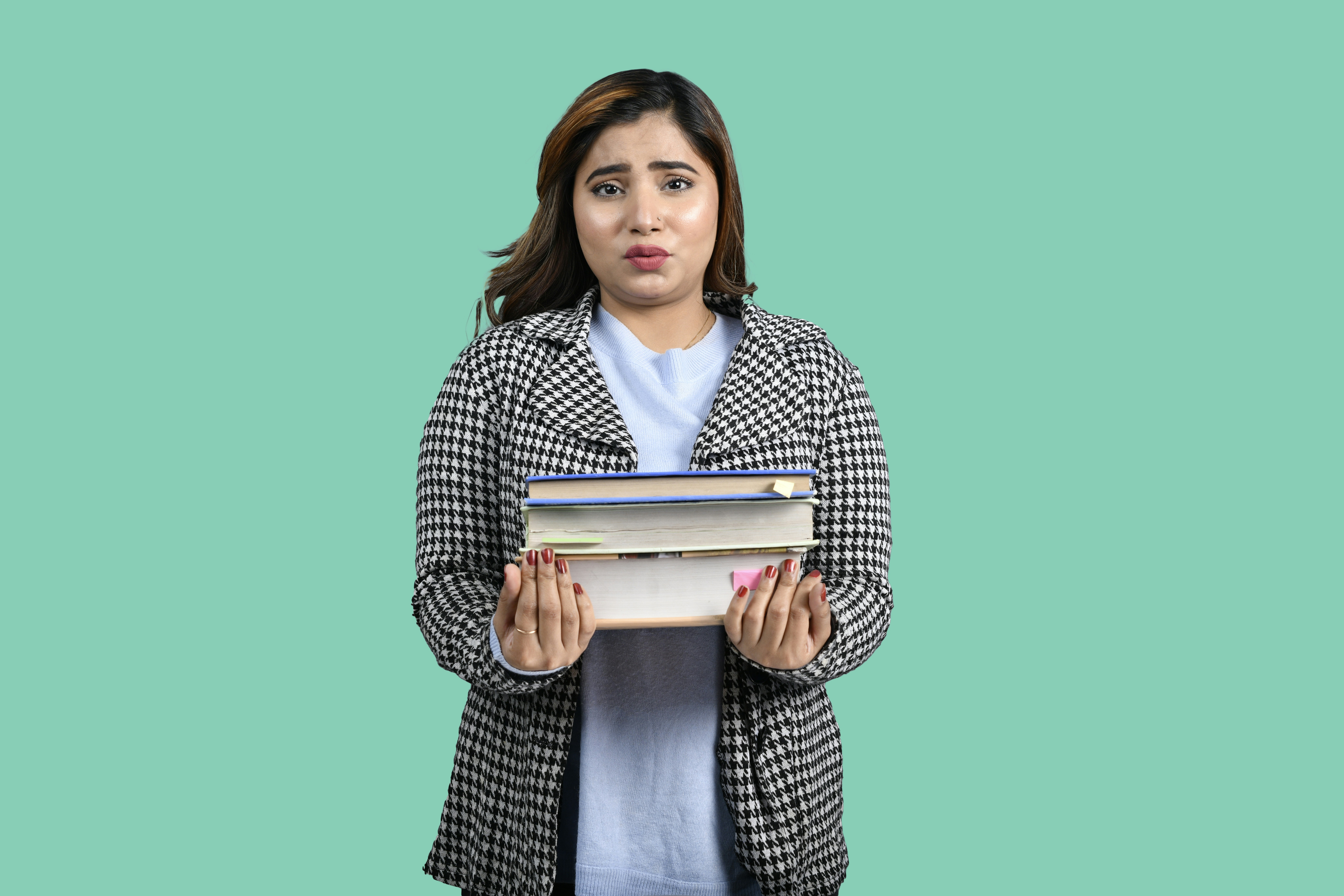 A confused student holding an open textbook, looking puzzled by its content.