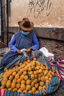 a person selling oranges