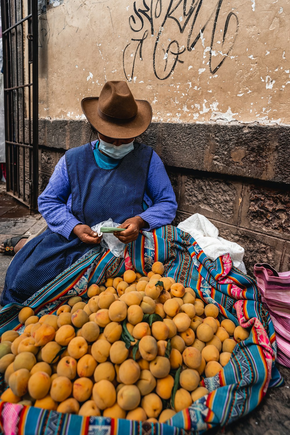 a person selling oranges