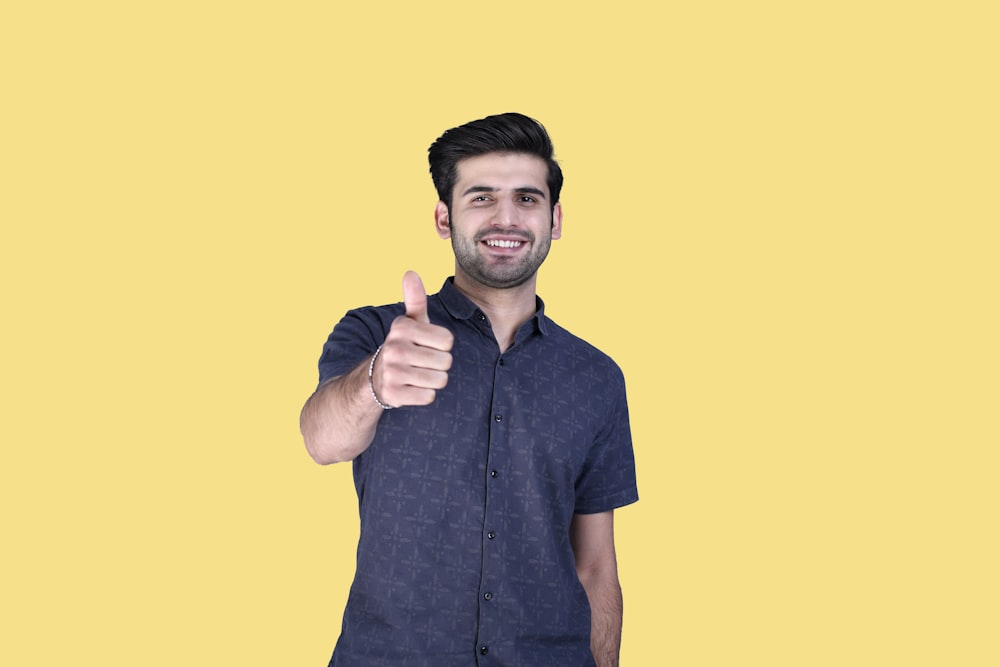 a man giving a thumbs up
