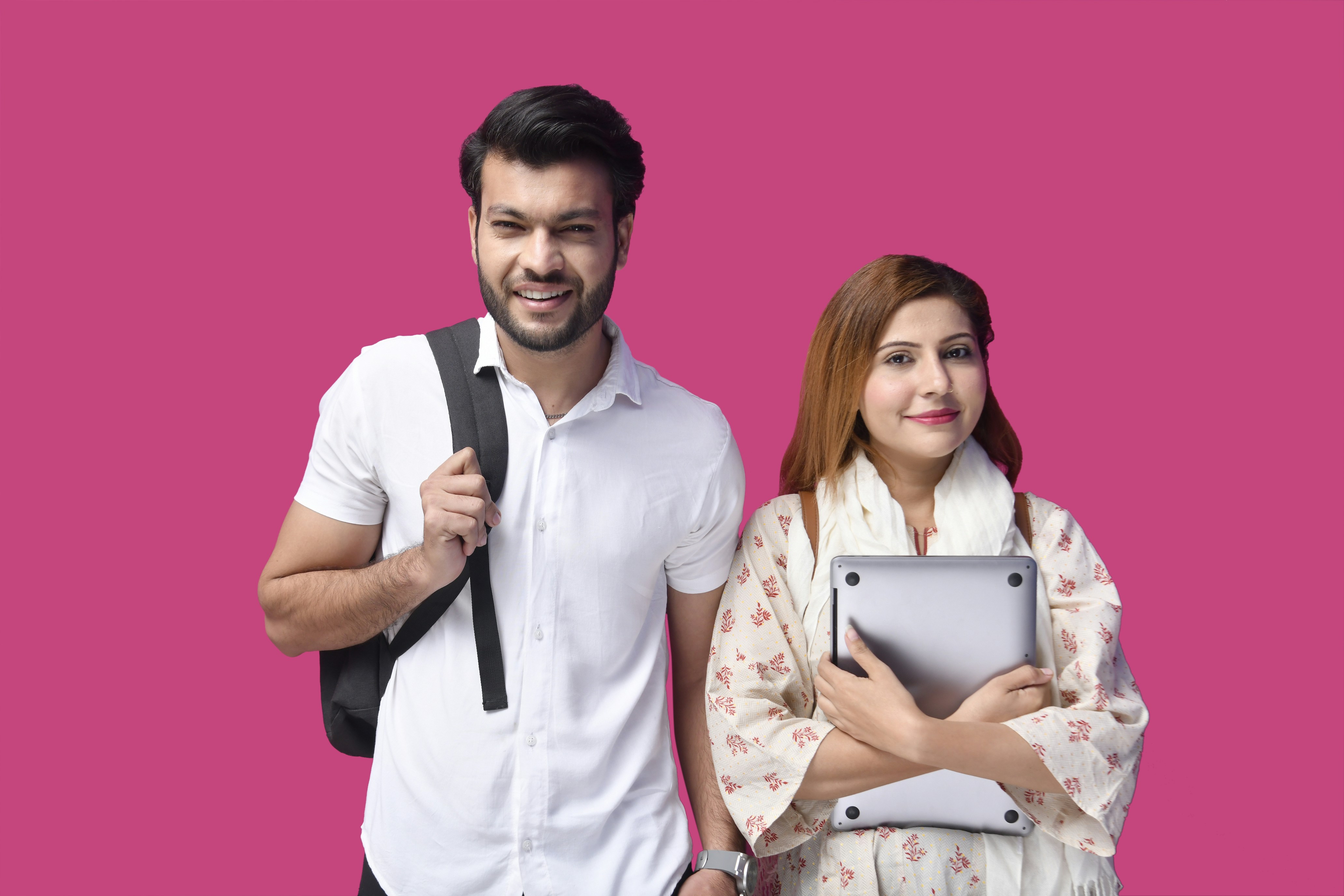 a man and a woman holding a tablet
