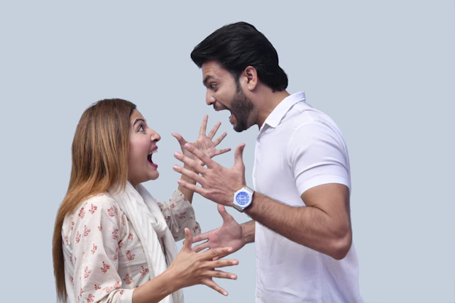 a man and a woman holding hands
