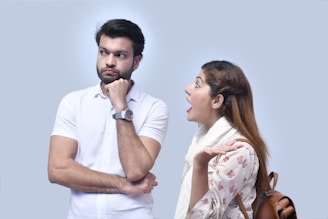 a man and woman looking at each other