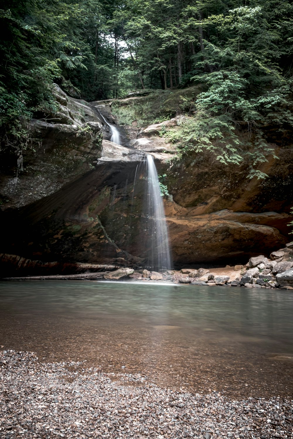 a waterfall over a rocky cliff