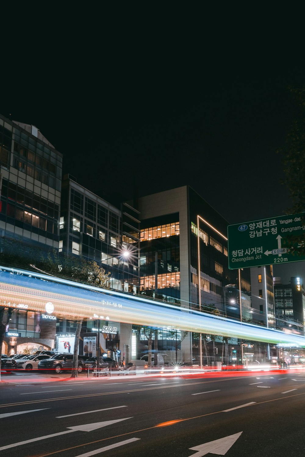 a street with a building and a sign on it