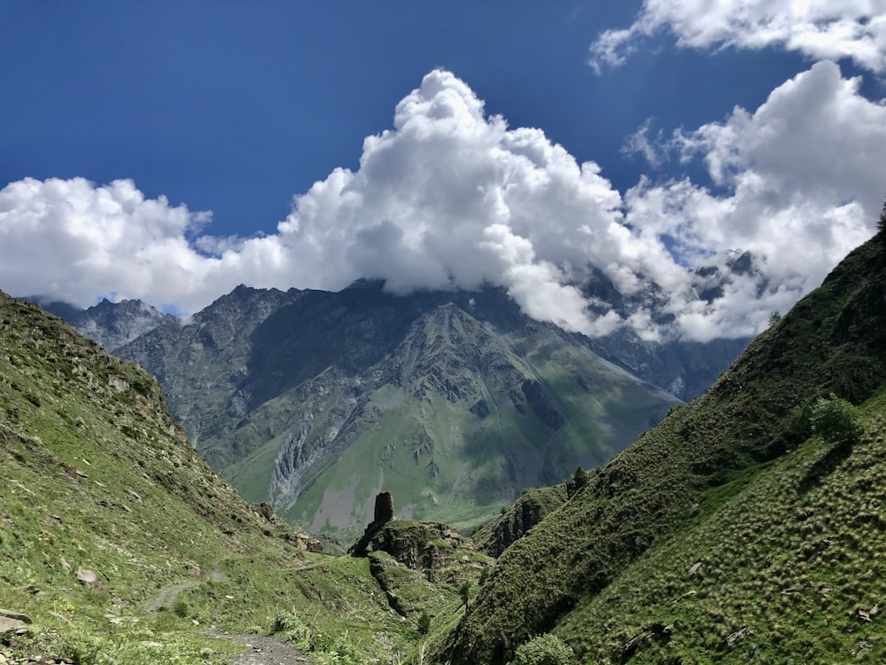 a mountain range with clouds