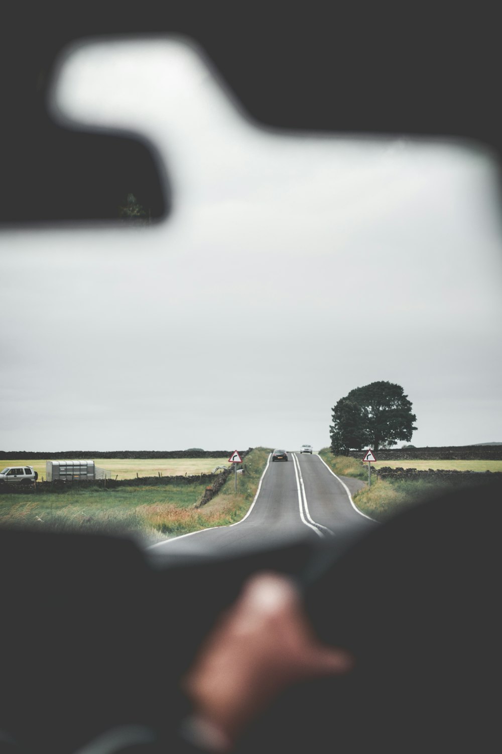 a person driving a car on a road