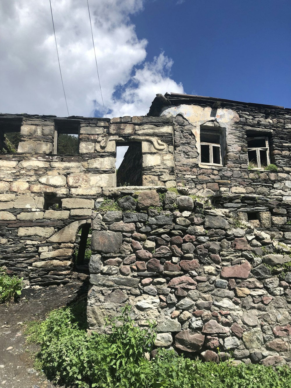 a stone building with windows