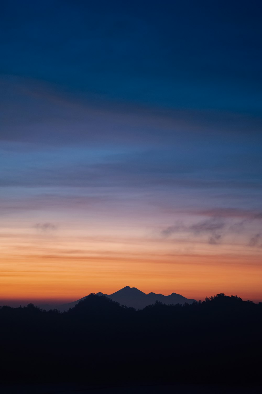 a mountain range at sunset