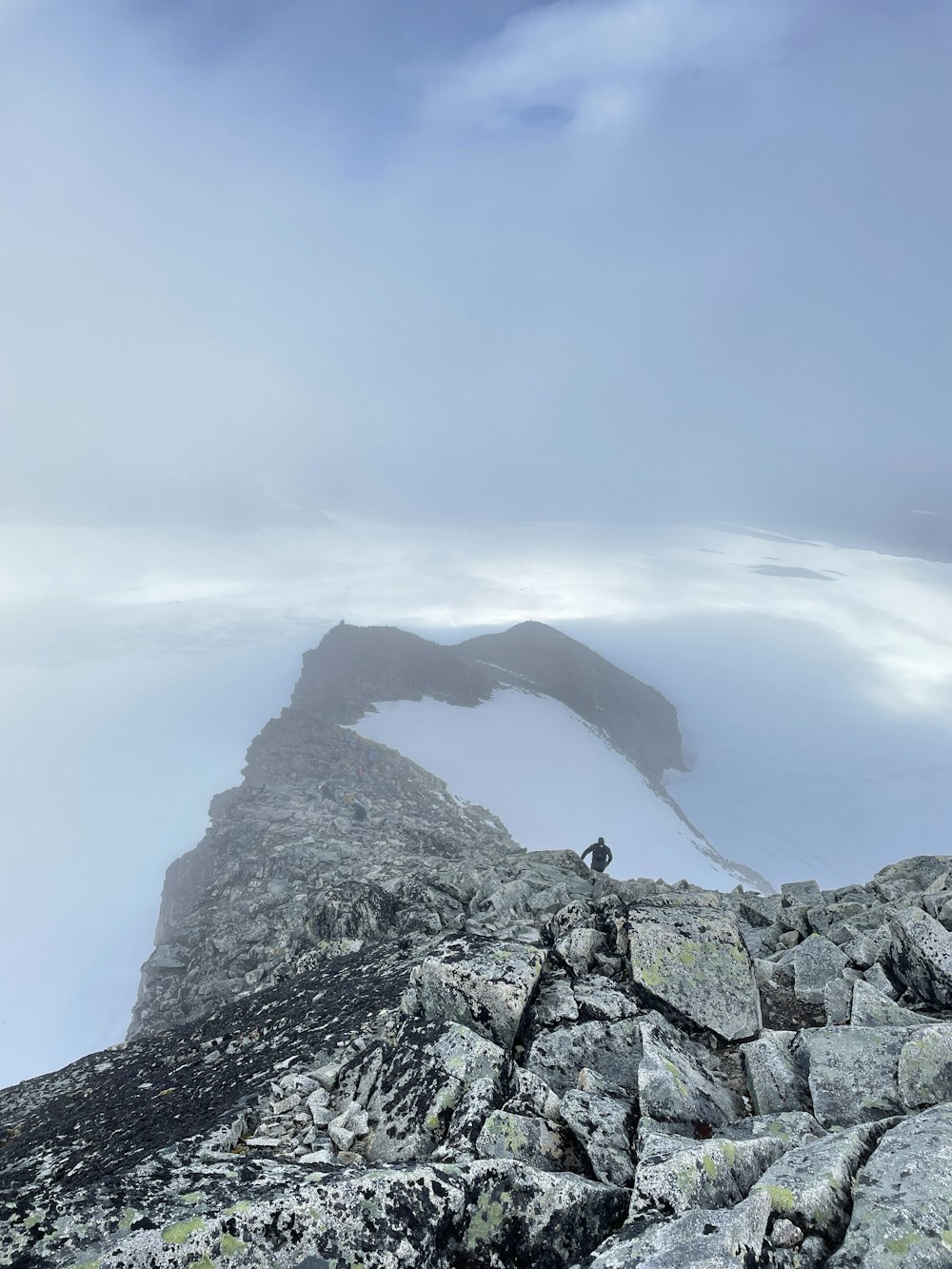 a person standing on a rock