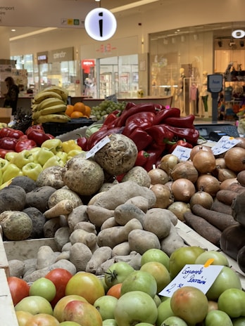Close-up of colorful Honduran fruits and vegetables displayed in the supermarket.