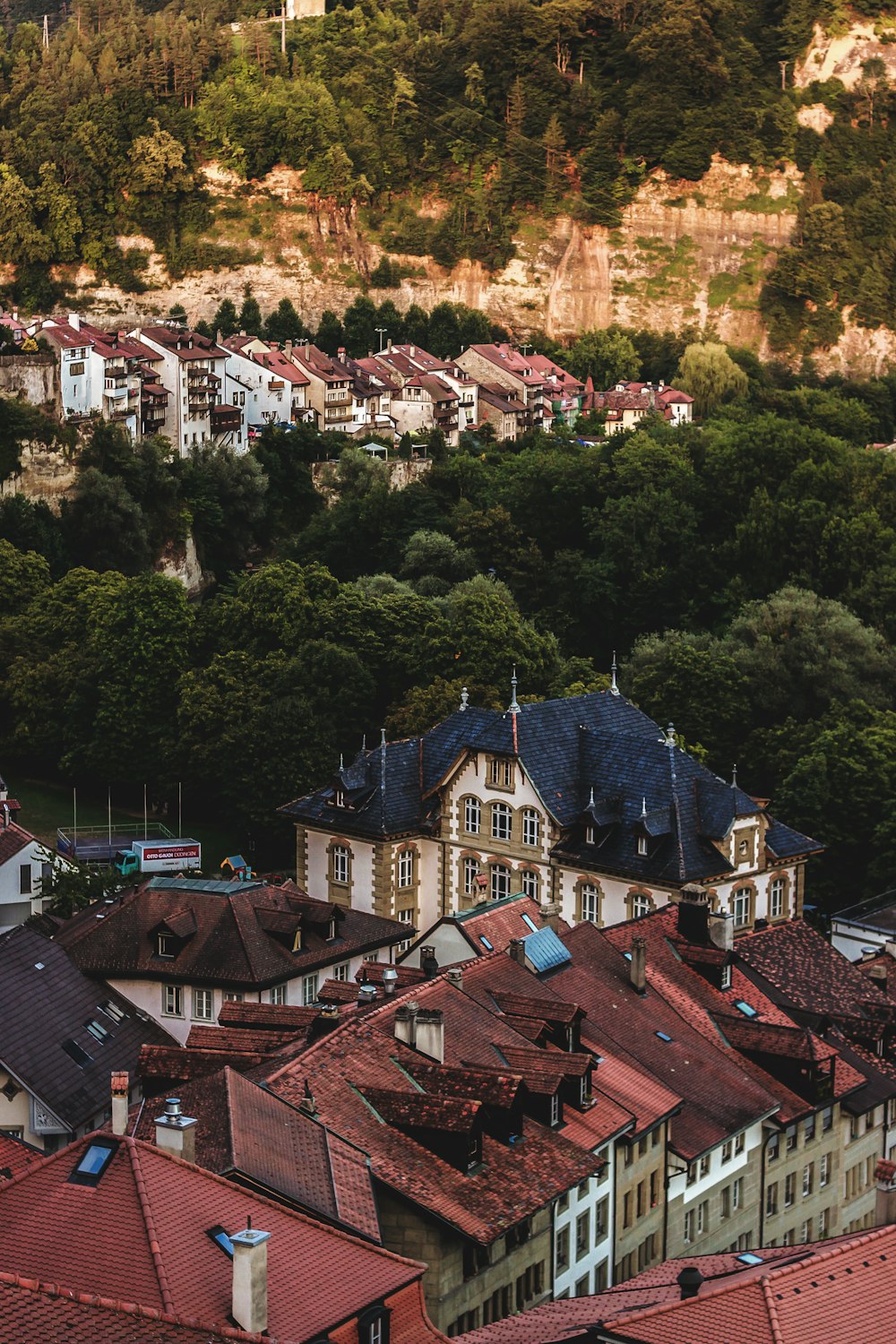 a group of buildings with trees in the back