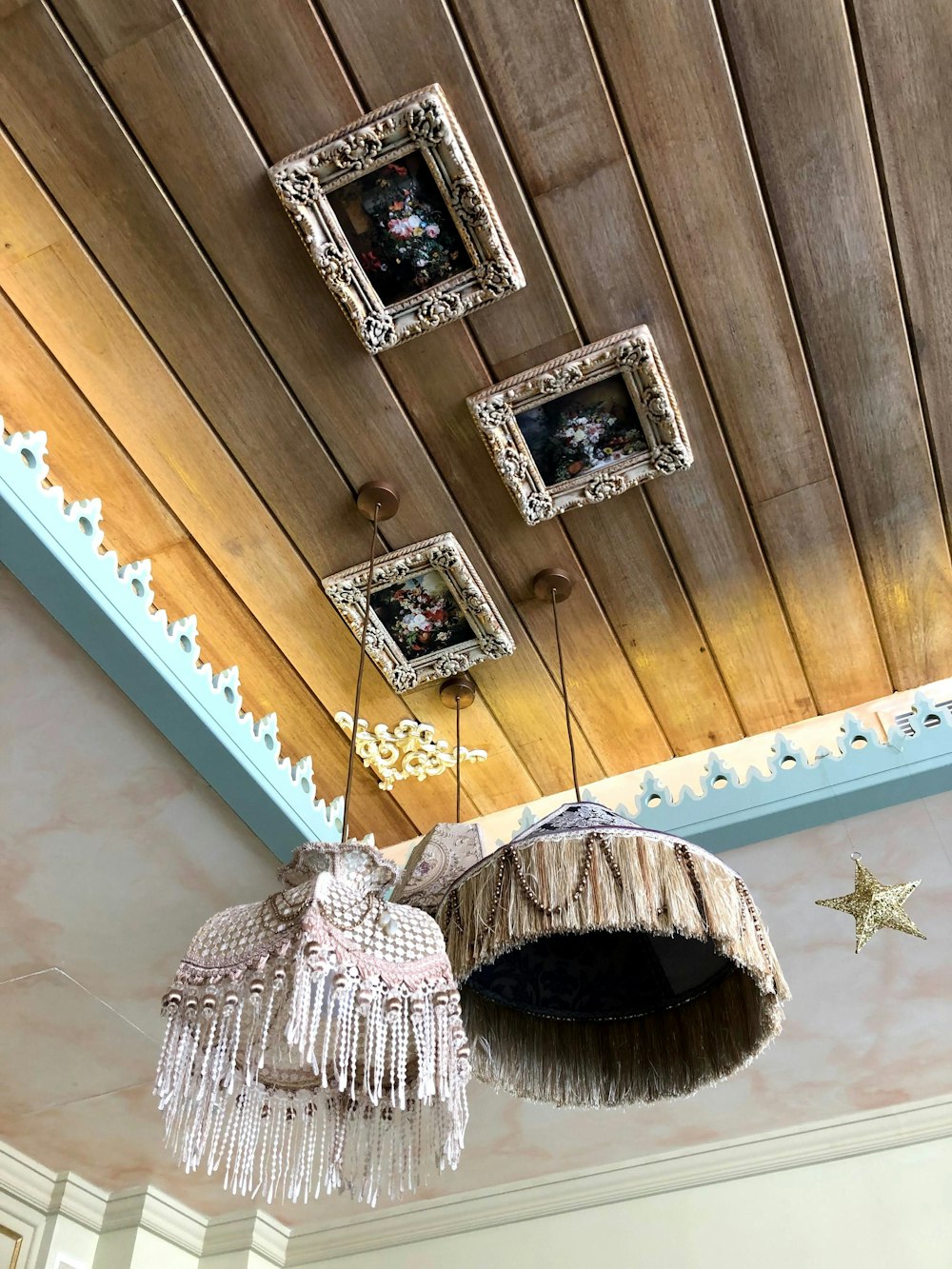 a hat and a necklace on a shelf