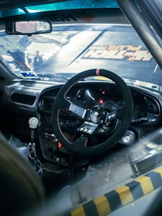 a steering wheel and dashboard of a car