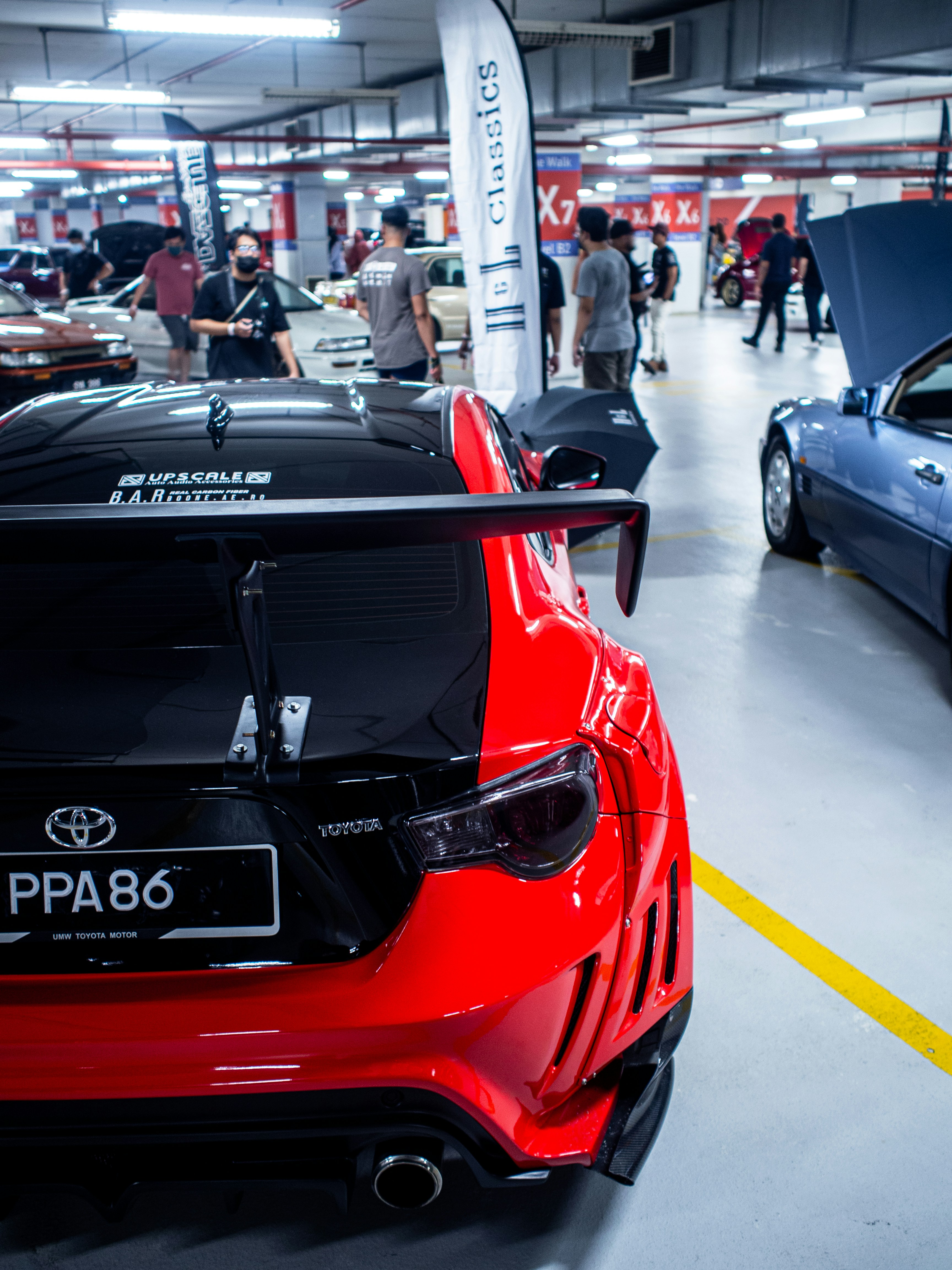 Red sports car in virtual garage spotlight