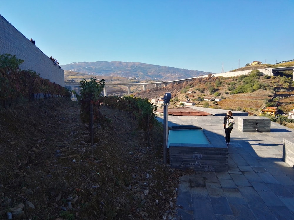 a person walking on a stone path