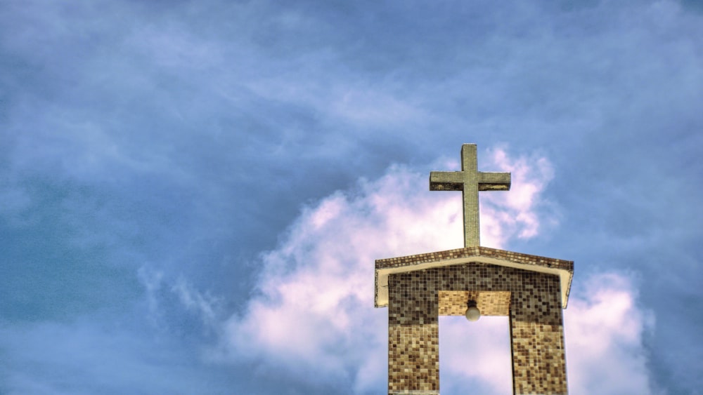 a large tall tower with a cloudy blue sky